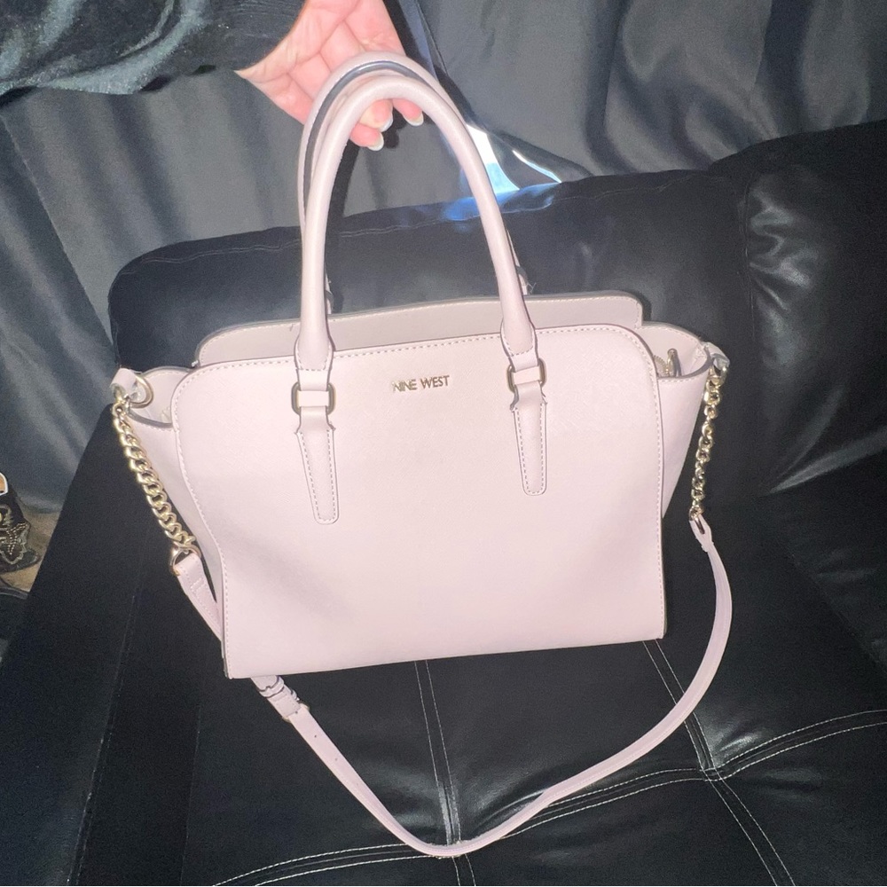 Pink-Nine west purse with shoulder strap.